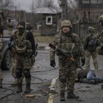 Ukrainian forces retake areas near Kyiv amid fear of traps.