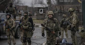 Ukrainian forces retake areas near Kyiv amid fear of traps.