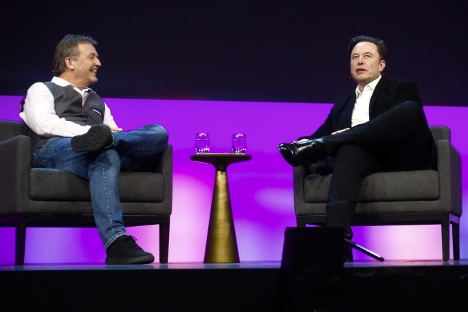 Photo: Elon Musk speaking at podium - illustrating article 'Acquisition of Twitter by Elon Musk'