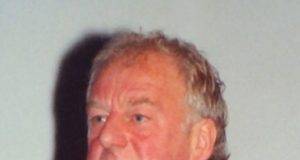 Photo: Bernard Hill smiling in a suit - illustrating article 'Bernard Hill'