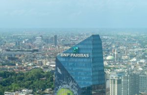 BNP Paribas Pleads Guilty to Sanctions Violations BNP Paribas bank building exterior in Paris, France, with the company logo displayed above the entrance.