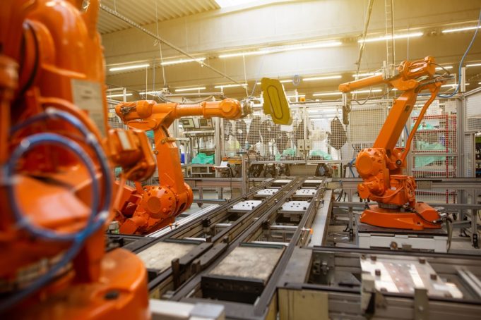 Google DeepMind restricts new robotics models to four trusted partners A robotic arm with a gripper approaches a cup on a table, demonstrating embodied reasoning in a controlled testing environment.