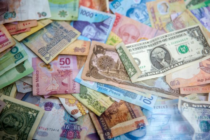 Bloomberg Revealed 2013 Forex Rigging Scheme Involving Major Banks Traders huddle over Bloomberg terminals in a dimly lit dealing room as forex benchmark rates flash on screens.