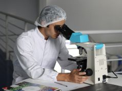 Abbott Buys Exact Sciences in $21B Cancer Deal A Cologuard test kit box sits on a table, representing the at-home colorectal cancer screening product central to Abbott's acquisition of Exact Sciences.