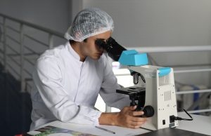 Abbott Buys Exact Sciences in $21B Cancer Deal A Cologuard test kit box sits on a table, representing the at-home colorectal cancer screening product central to Abbott's acquisition of Exact Sciences.