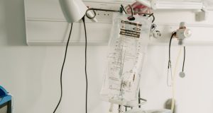 Dengue Cases Surge 416% Across Latin America Health workers in protective gear treat dengue patients in a crowded hospital ward in Brazil during the 2024 outbreak.