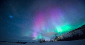Green and pink aurorae illuminate the night sky over Texas during the May 2024 Gannon solar storm.