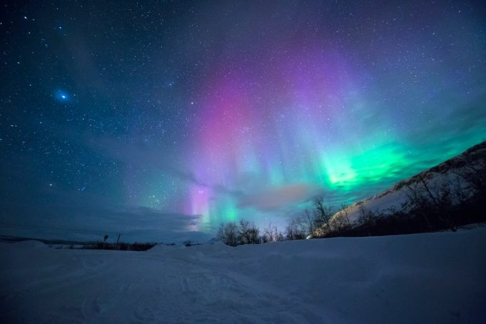 Scientists Name May 2024 Solar Storms the Gannon Storm Green and pink aurorae illuminate the night sky over Texas during the May 2024 Gannon solar storm.