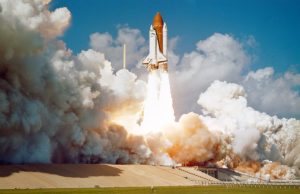SpaceX Starship Reaches Orbital Velocity in Third Test SpaceX Starship rocket launches from a test pad, ascending into a clear blue sky during its third flight test.