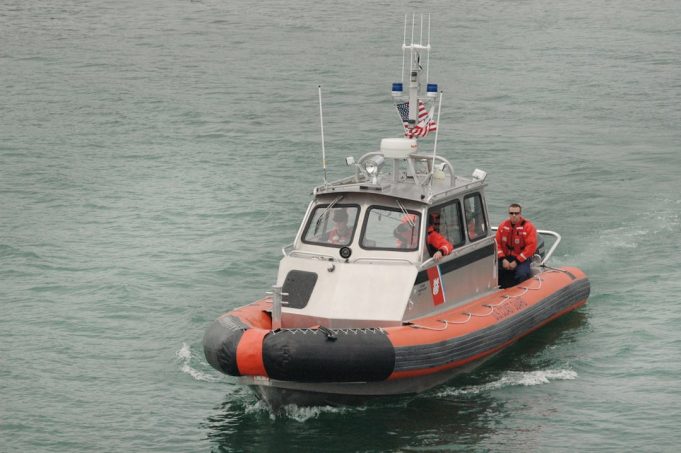 Coast Guard Recovers Four Survivors, Five Dead in Florida Inlet Capsizing A Coast Guard rescue boat navigates the turbulent waters of the St. Lucie Inlet near Hutchinson Island.