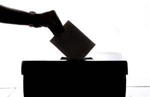 Electoral workers post the official vote tally outside the National Electoral Council headquarters in Tegucigalpa.