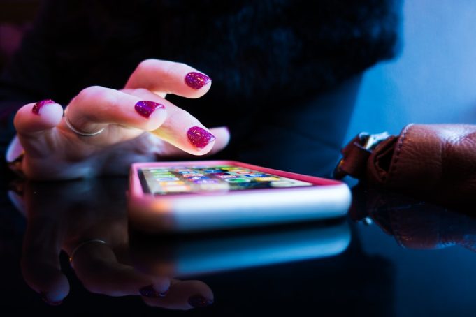 Google Makes Gemini Default Assistant on New Pixel 9 Phones A Google Pixel 9 phone displays the Gemini assistant interface on its screen in a user's hand.