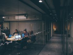 Anthropic Raises $13B in Record AI Funding Round Anthropic co-founders Daniela and Dario Amodei stand in a modern office, discussing AI safety on a screen displaying Claude's constitutional AI principles.