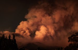 Corfu Wildfires Force Chaotic Boat Evacuations Overcrowded rescue boats packed with evacuees pull away from a burning Corfu shoreline as flames consume the island.