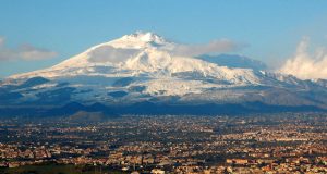 Mount Etna Erupts, Forces Catania Airport Closure Mount Etna spews ash and lava into the sky over the Sicilian landscape, with smoke billowing near Catania Airport