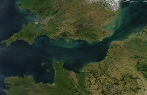 Three Migrants Die in English Channel Crossing Rescue workers assist migrants on a boat in the English Channel near the coast.