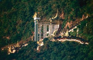 Myanmar Bus Plunge Kills 5, Injures 25 in Shan State Rescuers and bystanders gather near a damaged bus at the bottom of a ravine in Shan State, Myanmar.