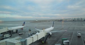Jet Bridge Collapse Damages American Airlines 787 A collapsed jet bridge rests against an American Airlines Boeing 787 aircraft at a Dublin Airport gate, with emergency personnel nearby.