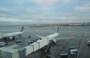 Jet Bridge Collapse Damages American Airlines 787 A collapsed jet bridge rests against an American Airlines Boeing 787 aircraft at a Dublin Airport gate, with emergency personnel nearby.