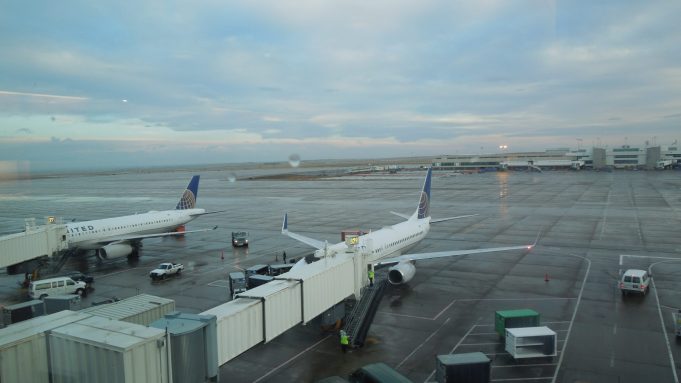 A collapsed jet bridge rests against an American Airlines Boeing 787 aircraft at a Dublin Airport gate, with emergency personnel nearby.