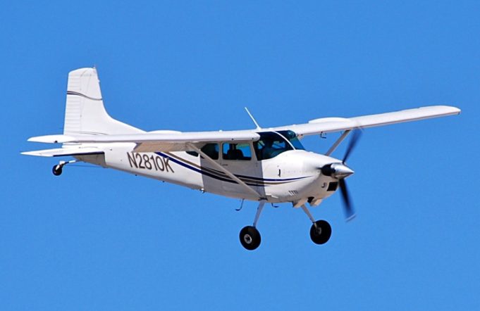 Small Plane Crashes into Platte River in Nebraska Killing Three People Rescue boats circle a partly submerged white Cessna 180 in the muddy Platte River as crews work along the wooded bank under gray skies.