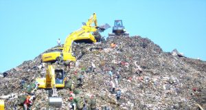 Rescue teams dig through garbage after a section of the Bantar Gebang landfill gave way during torrential rain.