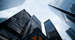 Deutsche Bank Slips to Sixth in German Market Deutsche Bank headquarters in Frankfurt with German corporate logos in the background