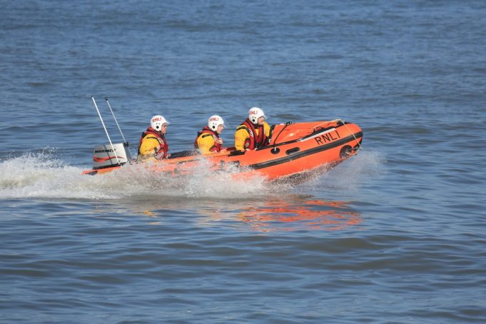 At Least Four Dead in Dhaka River Boat Capsizing; Rescue Ongoing Rescue workers search the Buriganga River near a partially submerged water bus in Dhaka.