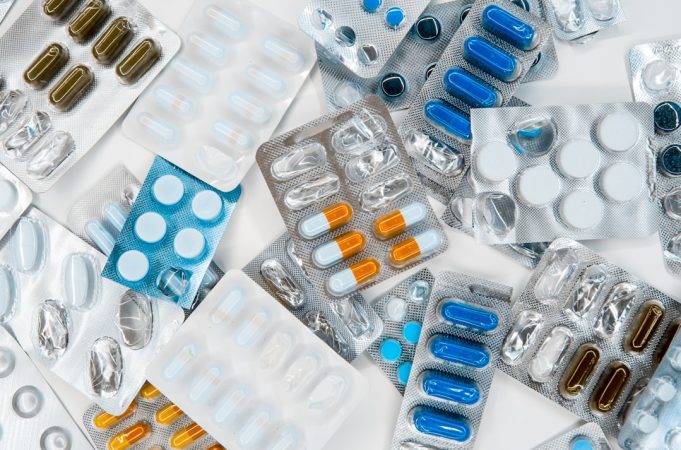 EU approves dual-drug prostate cancer pill targeting two pathways A healthcare professional holds a pill bottle labeled with niraparib and abiraterone acetate, representing the new dual-drug prostate cancer treatment.