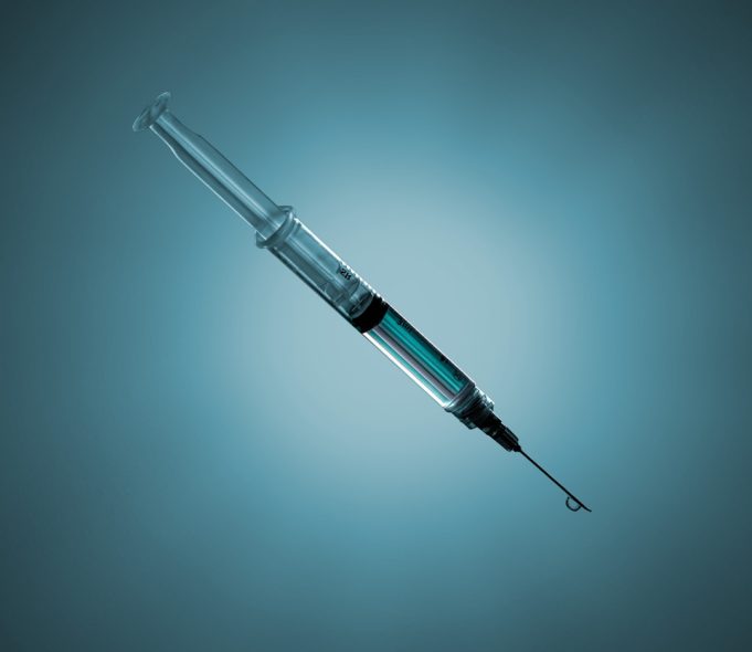 FDA Approves Tirzepatide as New Dual-Action Injectable for Type 2 Diabetes A person holding a Mounjaro injector pen, preparing for a subcutaneous injection in a home setting.