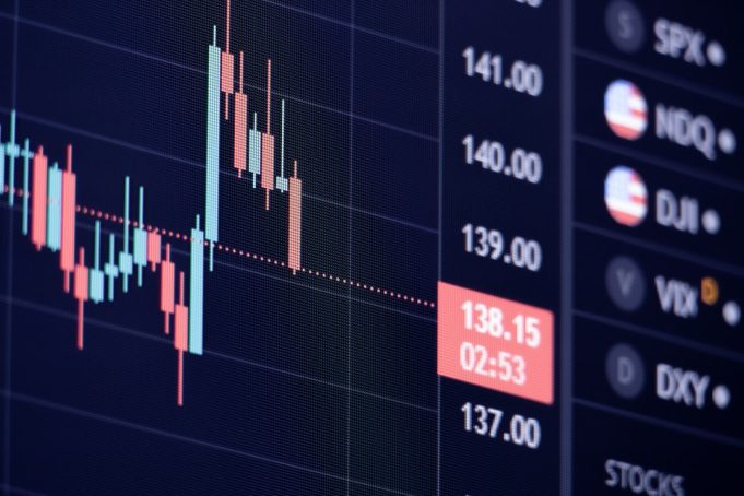 Federal Reserve cuts rates to near zero; markets continue to fall Traders on the floor of the New York Stock Exchange watch screens showing plunging stock prices after the Federal Reserve emergency rate cut.