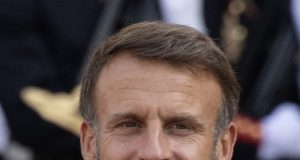 French McKinsey Scandal Probes Macron Ties French President Emmanuel Macron speaks at a podium as the McKinsey scandal unfolds over government consulting ties.