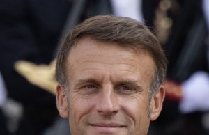 French McKinsey Scandal Probes Macron Ties French President Emmanuel Macron speaks at a podium as the McKinsey scandal unfolds over government consulting ties.