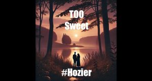 Hozier performing on stage with a microphone, promoting his new song Too Sweet from the EP Unheard.