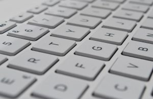 Lazarus Group Probed as DOJ Reveals Two Cyber Goals Cybersecurity analysts monitor screens displaying Lazarus Group attack patterns and multiple threat labels.