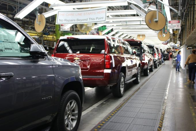 Malaysia's auto sector faces sales deadline as tax holiday nears end Workers on an assembly line in a Malaysian car plant restart production after the August 2021 lockdown ended.