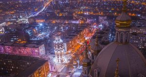 Mariupol Population Plunges to 120,000 Aerial view of Mariupol showing damaged buildings and empty streets along the Sea of Azov coast.