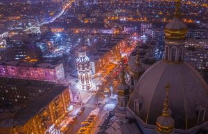 Mariupol Population Plunges to 120,000 Aerial view of Mariupol showing damaged buildings and empty streets along the Sea of Azov coast.
