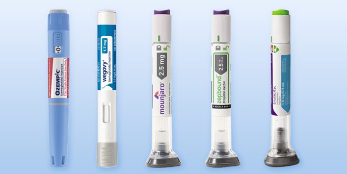 Pharmaceutical Research Laboratory Scientist loads GLP-1 injector pen while research screens show blood-sugar and weight-loss graphs in a modern lab.