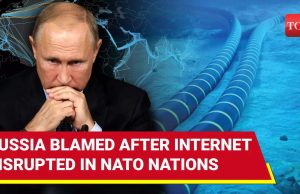 Putin Censorship Buckles Under Western Sanctions Moscow apartment blocks at dusk, laptop screens show spinning load wheels over Facebook and Twitter logos.