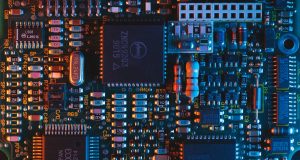 Assembly line stands idle while empty chip reels highlight the semiconductor shortage delaying Reliance and Google’s budget phone.