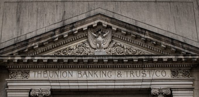 S&P Global projects 5-6% loan growth for Malaysian banks in 2023 S&P Global Ratings logo on a building facade in Kuala Lumpur, with Malaysian bank skyscrapers in the background.