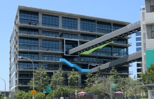Supreme Court Probes TikTok Ban in First Amendment Case Supreme Court building exterior with American flags flying under a clear blue sky