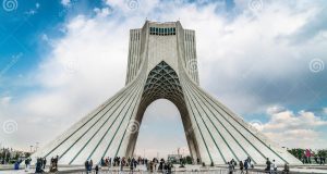US, Iran Agree to Two-Week Ceasefire in 2026 War Pakistani mediators facilitate talks between US and Iranian officials at a negotiation table, with documents and flags visible.