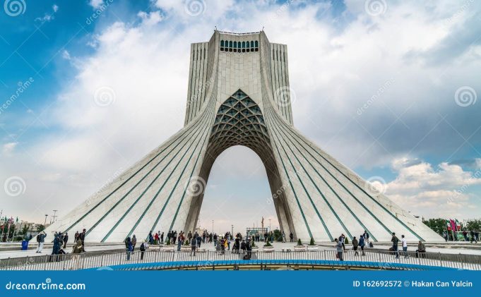 White House Pakistani mediators facilitate talks between US and Iranian officials at a negotiation table, with documents and flags visible.
