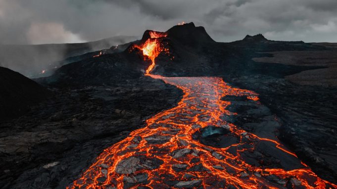 Phivolcs warns volcanic tsunami possible if Taal eruption intensifies to level 5 Taal Volcano erupts steam and ash over a lake, with nearby towns visible on the shoreline.
