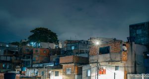 Anitta Funds Favela Projects in Rio Childhood Neighborhood Anitta performing on stage with colorful lights, representing her global music career rooted in Rio's north zone