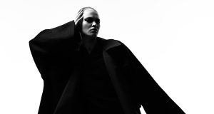 Met Gala 2025 Renamed Superfine Tailoring Black Style Guests in formal attire ascend the Met Gala steps under bright lights, with the Metropolitan Museum of Art facade in the background.
