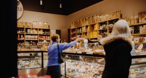 Boar’s Head Listeria Outbreak Kills 10, Sickens 60 A Boar's Head deli meat display case with a recall notice taped to the glass, highlighting the listeria contamination crisis.