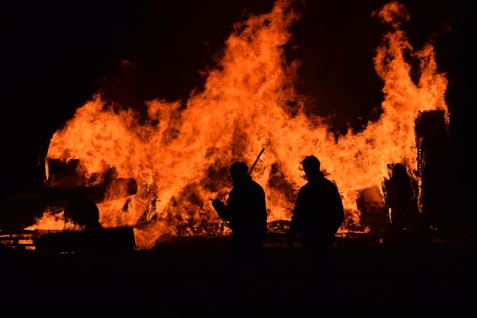 Maui Wildfire Death Toll Reaches 102 as Weather Systems Created Wind Tunnel Aerial view of charred buildings and smoke rising over Lahaina, Maui, after wildfires swept through the coastal town.
